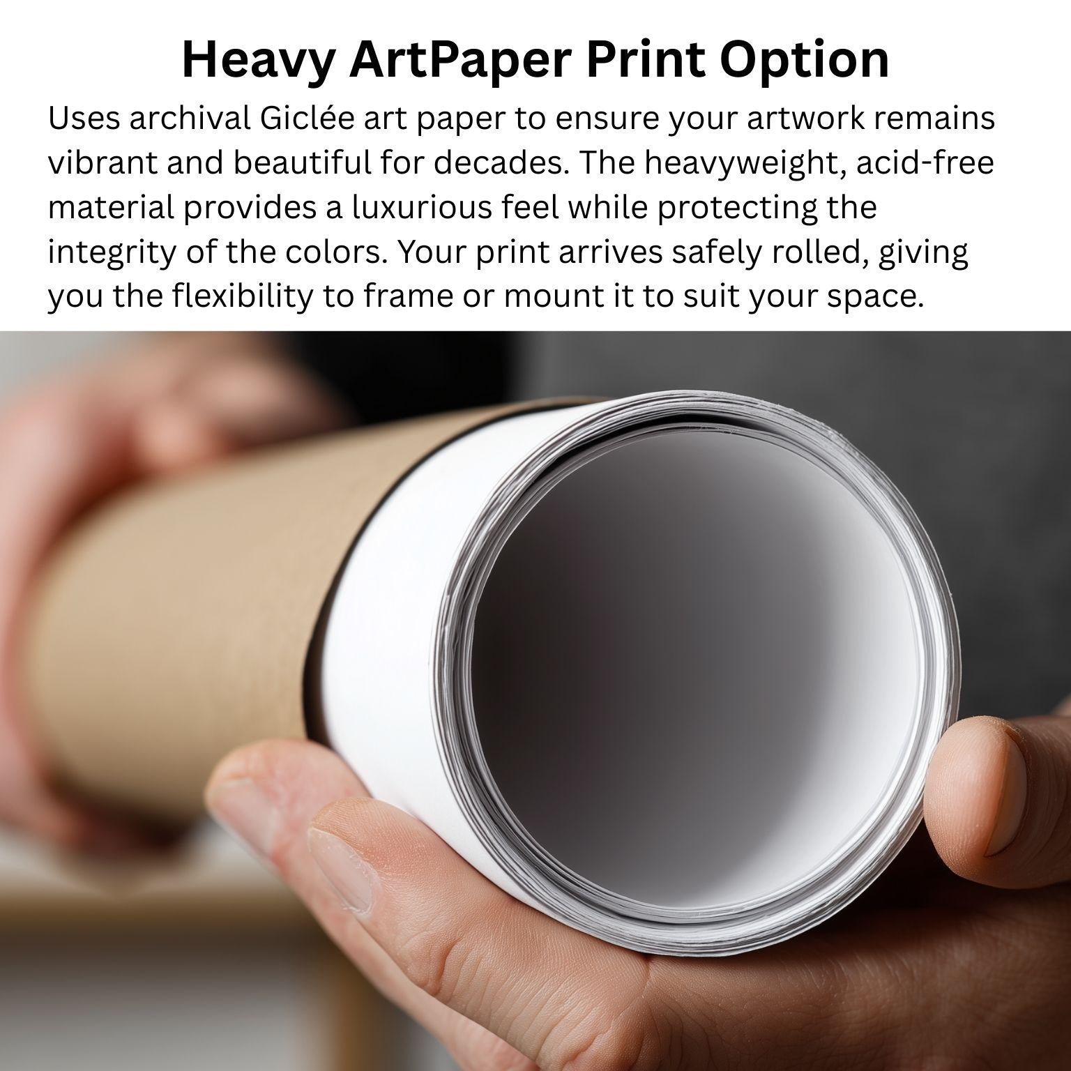 A person's hand holding a roll of heavy art paper, with a blurred background that appears to be a workspace or studio setting.