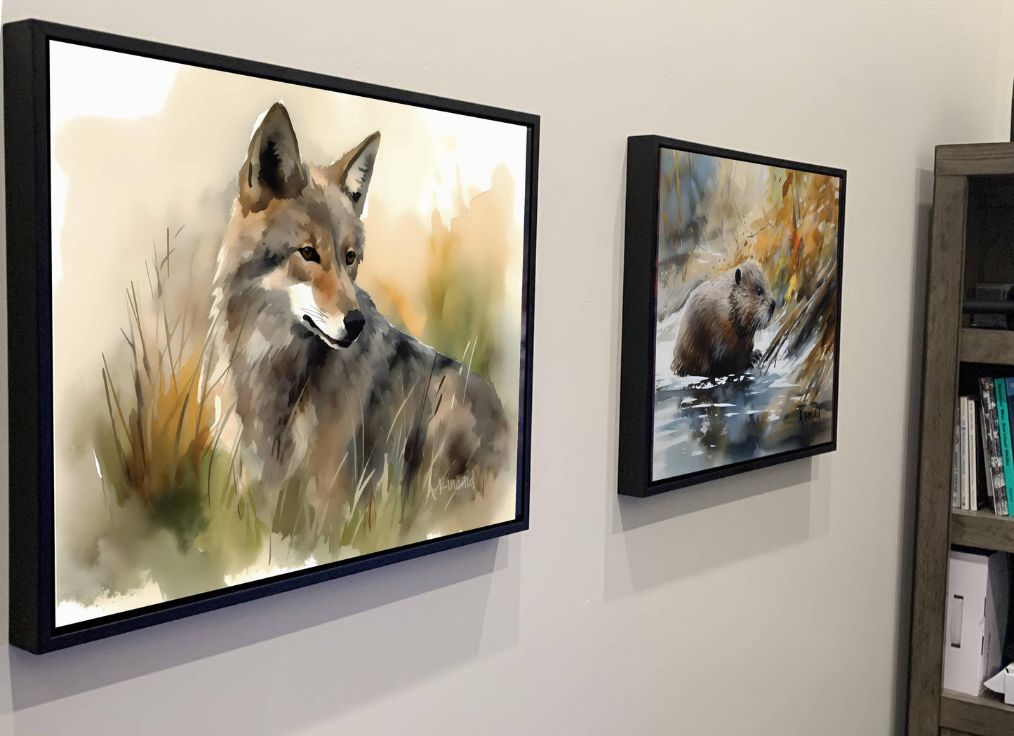 two framed paintings of animals, one of a wolf and the other of a bear, hanging on a wall.