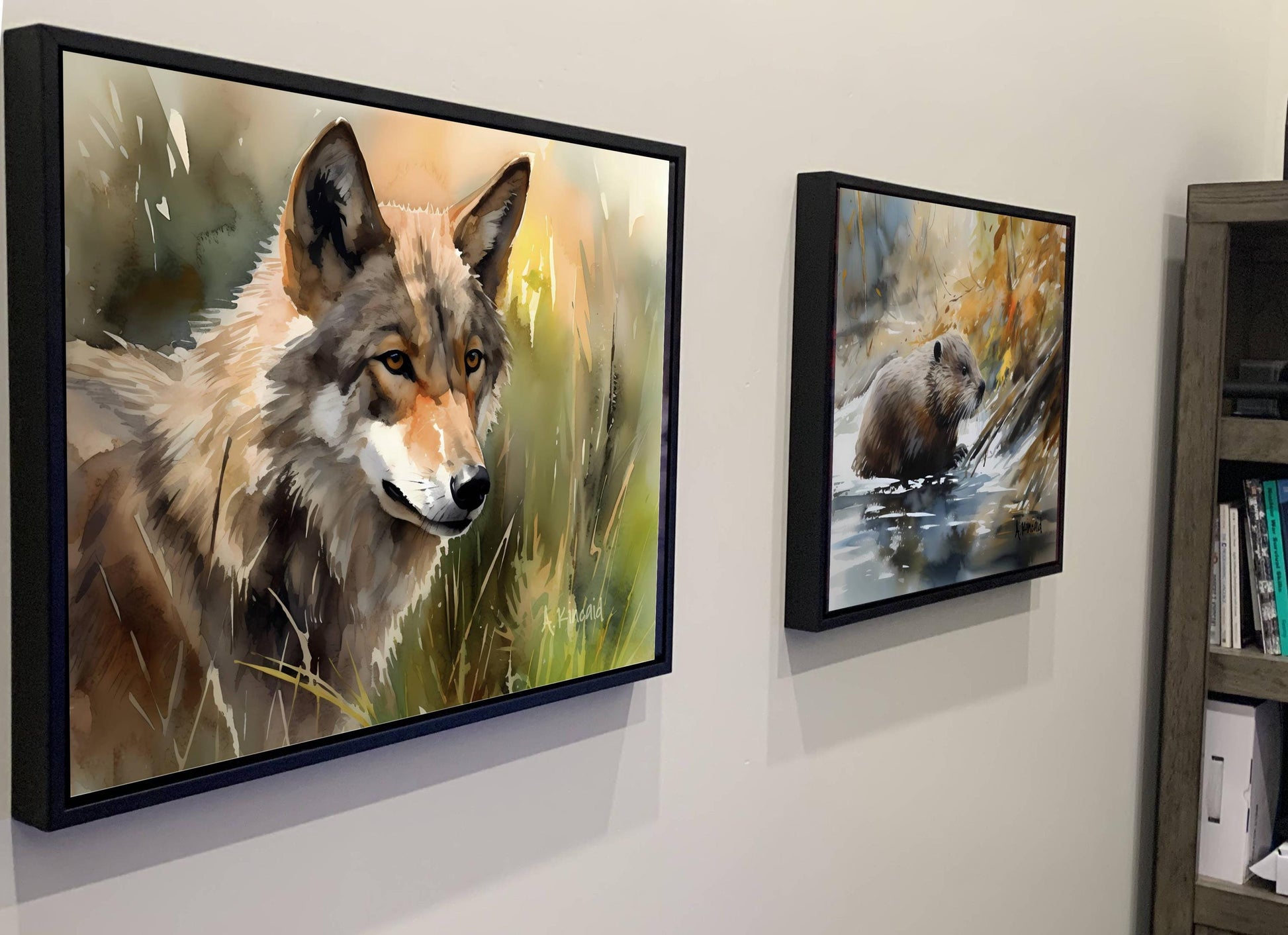 two framed paintings of animals, one of a wolf and the other of a bear, hanging on a wall.