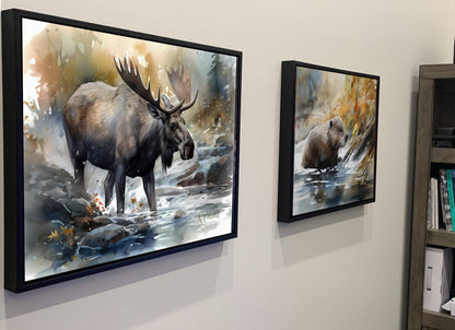 two framed paintings of moose and bears hanging on a wall.