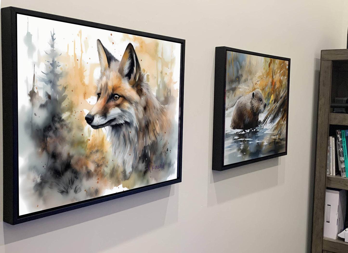 two framed paintings of animals, one of a fox and the other of a bear, hanging on a wall.