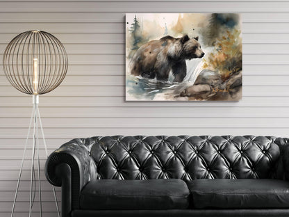 a painting of a bear in a natural setting, hanging on a wall above a black leather couch.