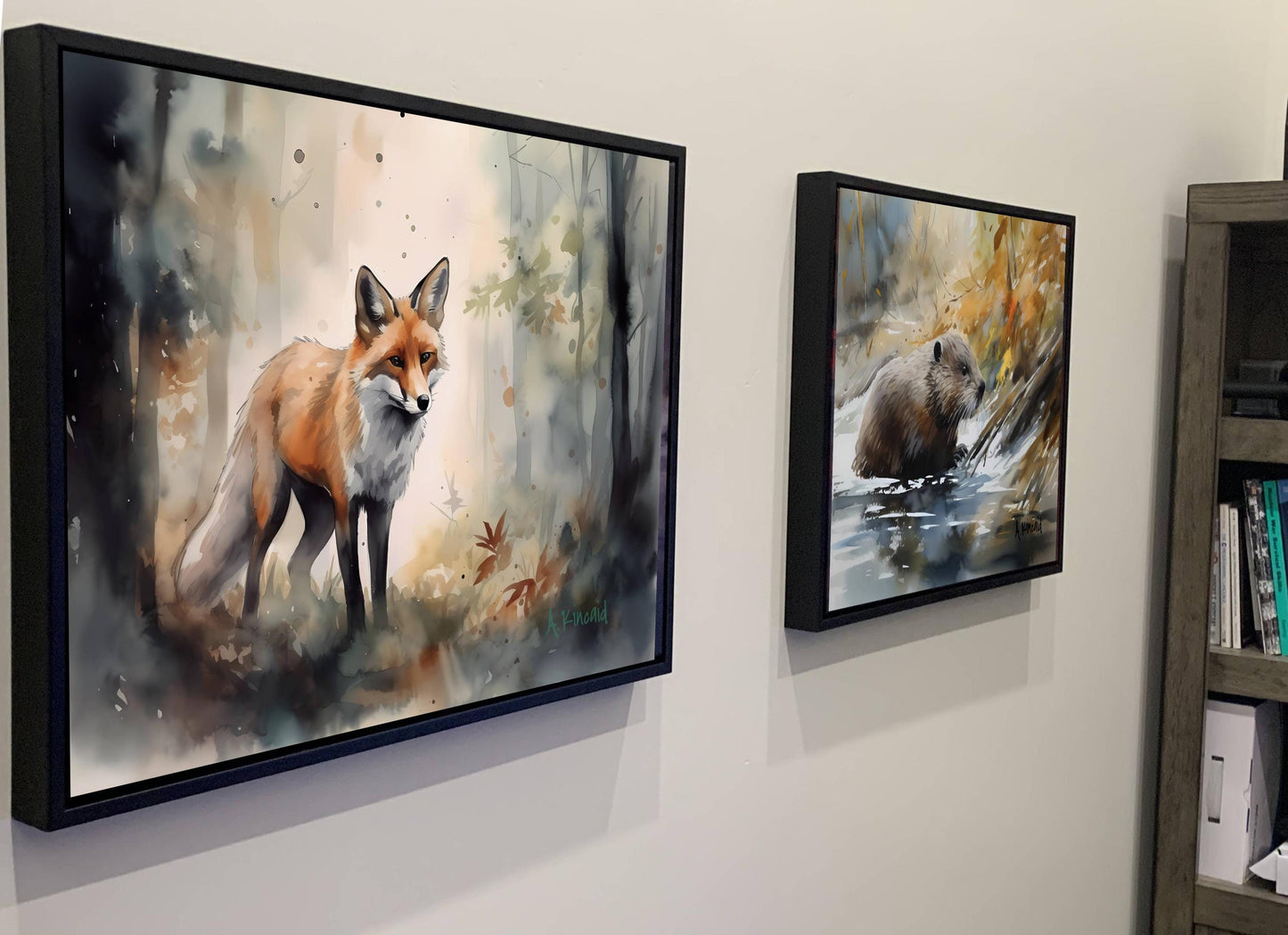two framed paintings of animals, one of a fox and the other of a bear, hanging on a wall.