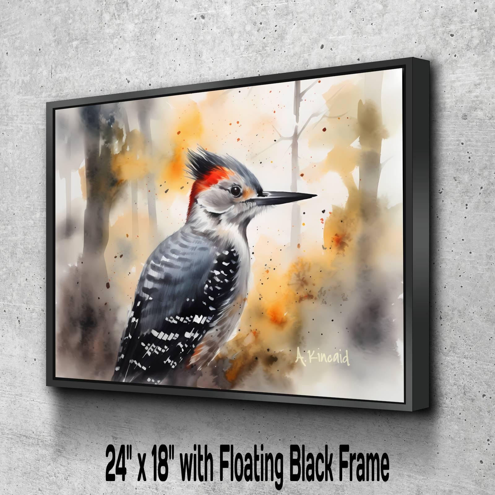A 24" x 18" painting of a woodpecker with a floating black frame, set against a background of orange and yellow splashes.