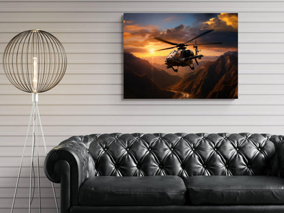 a black leather sofa in a living room, with a large framed picture of a helicopter flying over mountains in the background.