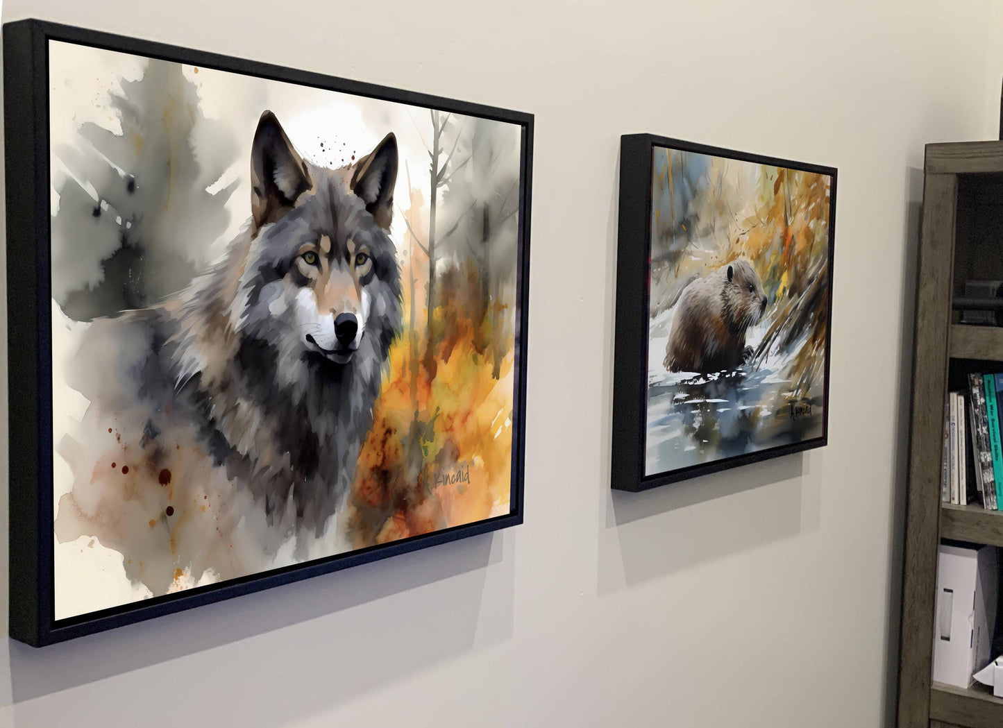 two framed paintings of animals, one of a wolf and the other of a bear, hanging on a wall.
