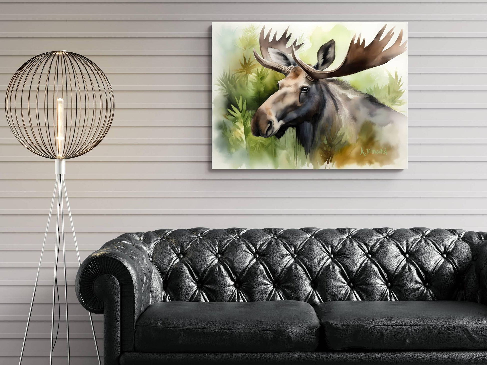 a large painting of a moose hanging on a wall above a black leather couch in a living room setting.