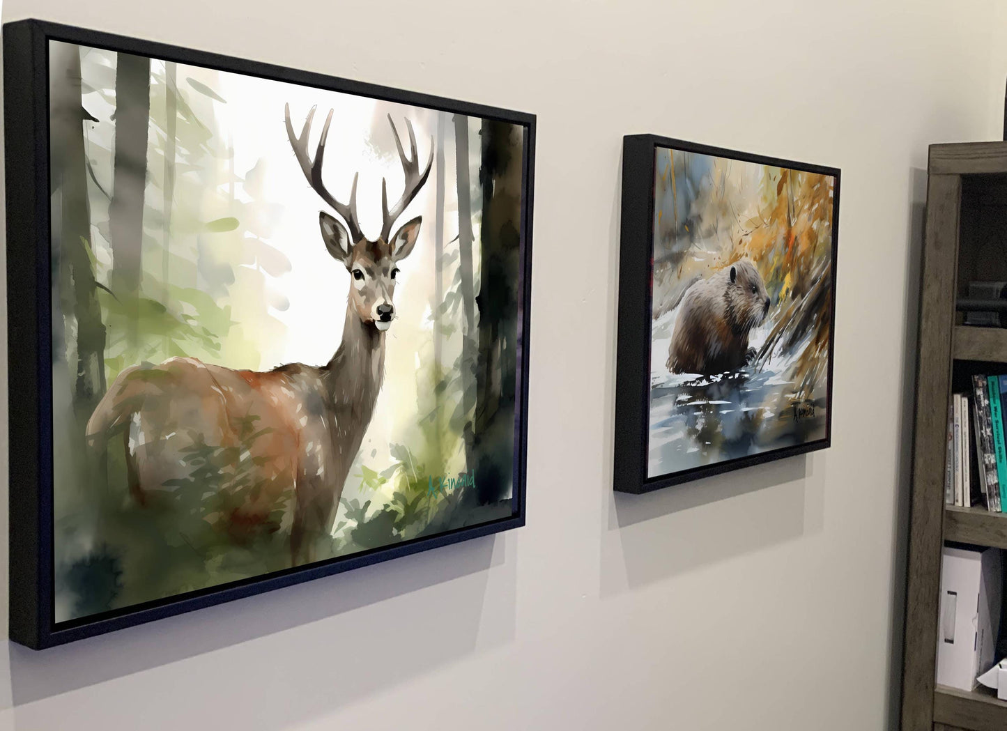 two framed paintings hanging on a wall, depicting a deer and a bear in a forest setting.