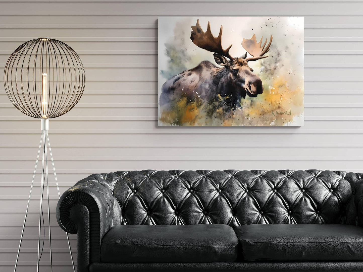 a large moose with large antlers, which is the central focus of the painting displayed on the wall above a black leather couch.