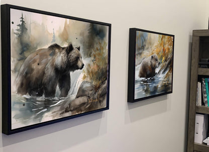 two framed paintings of bears in a forest setting, hanging on a wall.